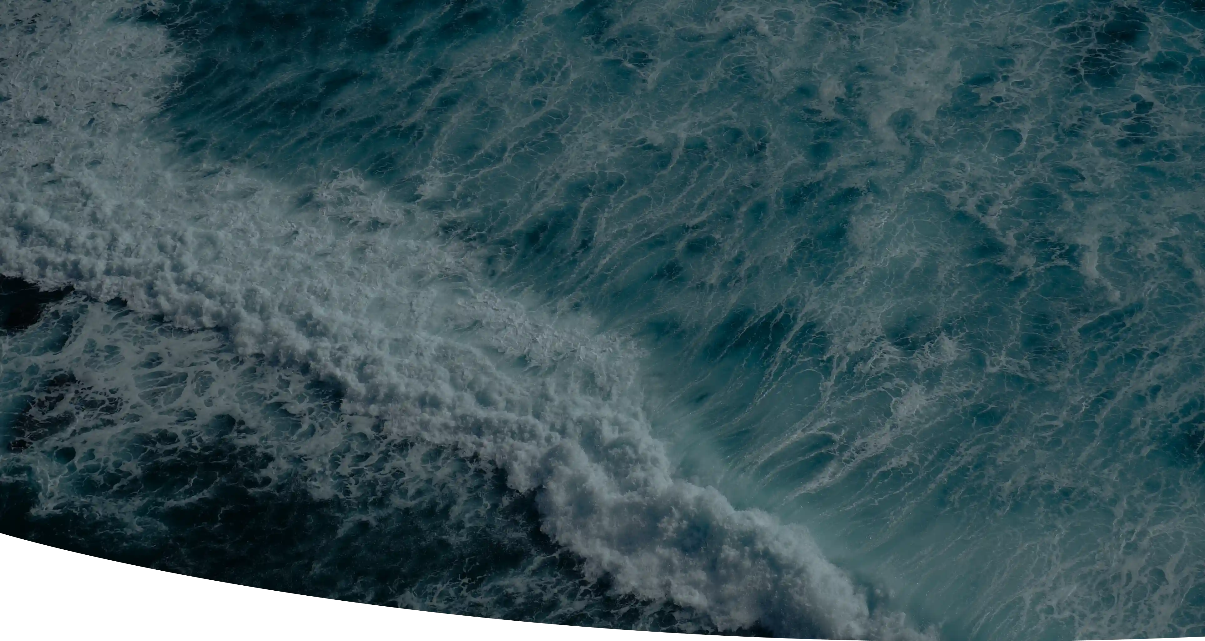 A banner showcasing a vivid and wavy ocean with deep green, blue, and white colors.