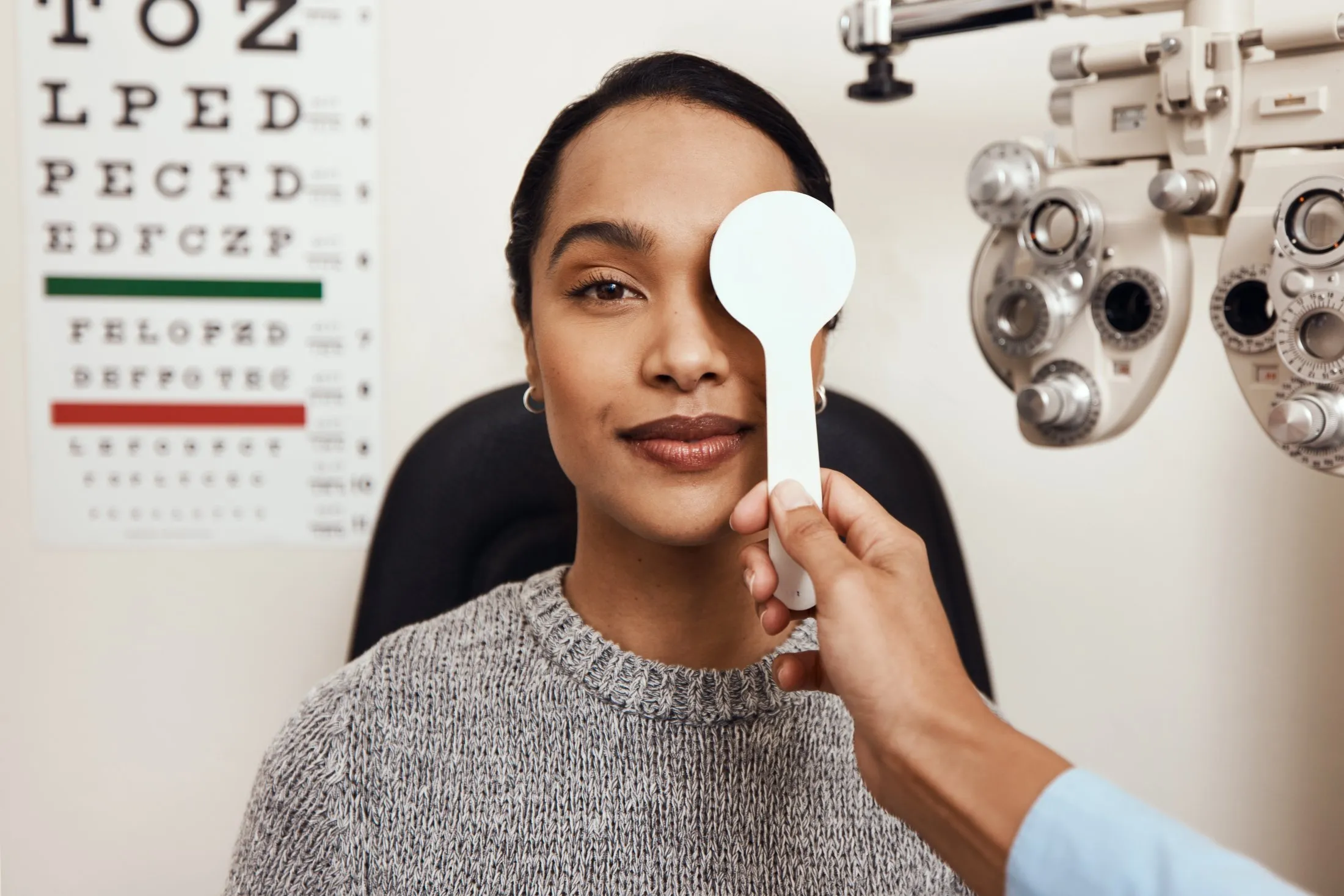 Eye exam with eye chart and vision testing equipment