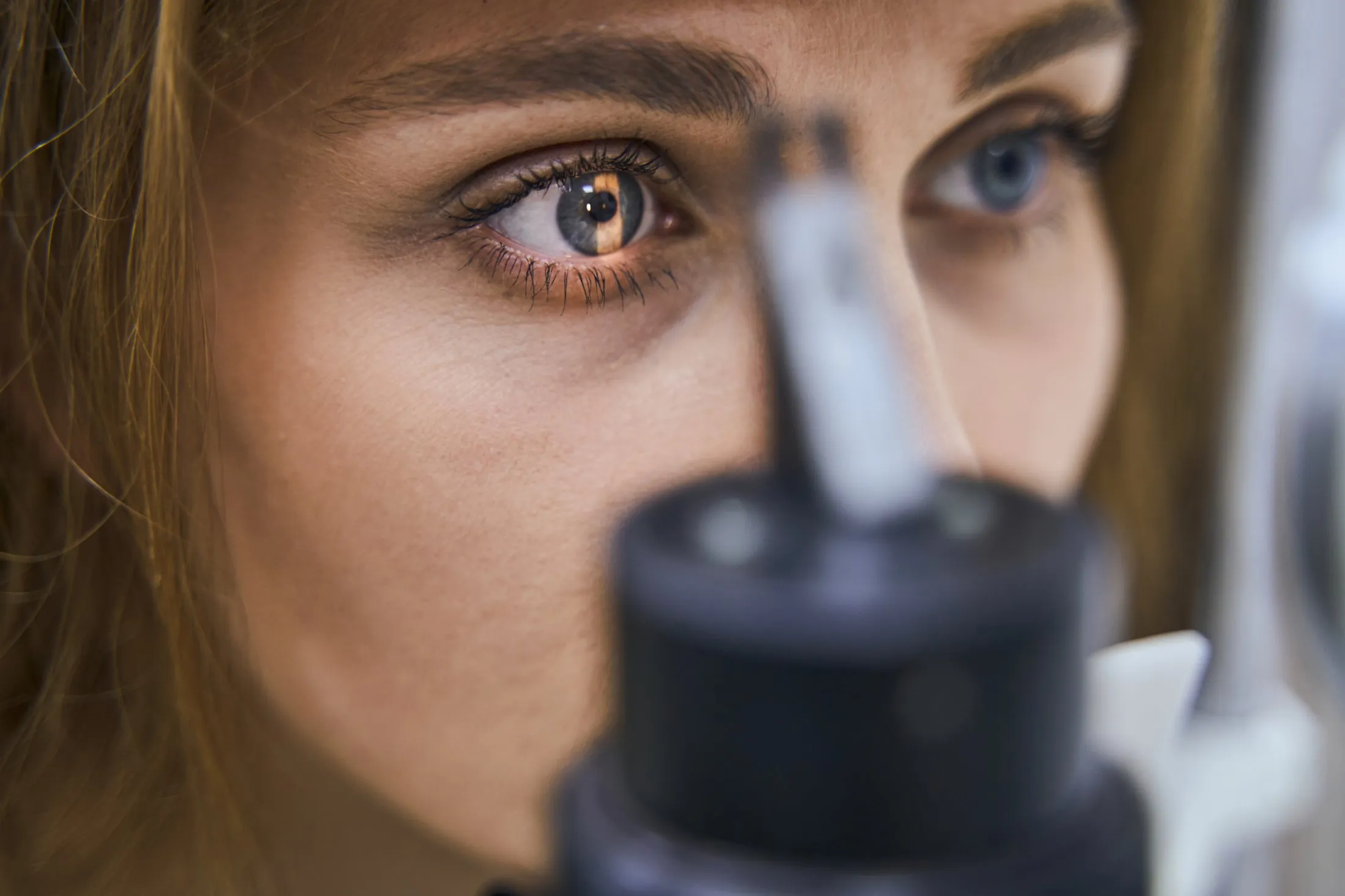 Close-up of an eye during comprehensive eye examination with medical equipment