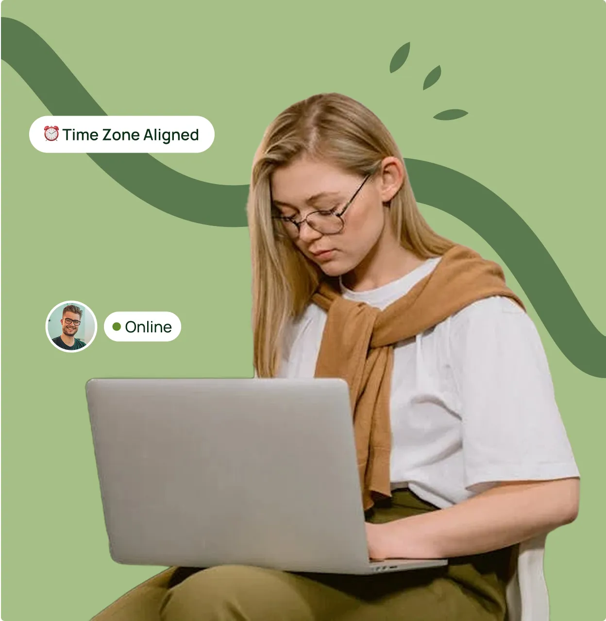 A woman sitting on a chair using a laptop.