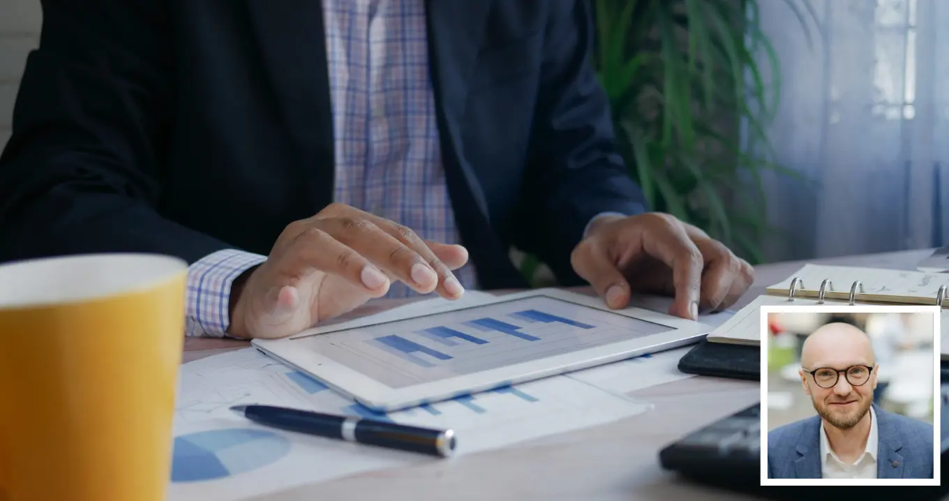 Controller analyzing financial data on a tablet – the evolving role of controllers as technology transforms organizations and creates new opportunities.