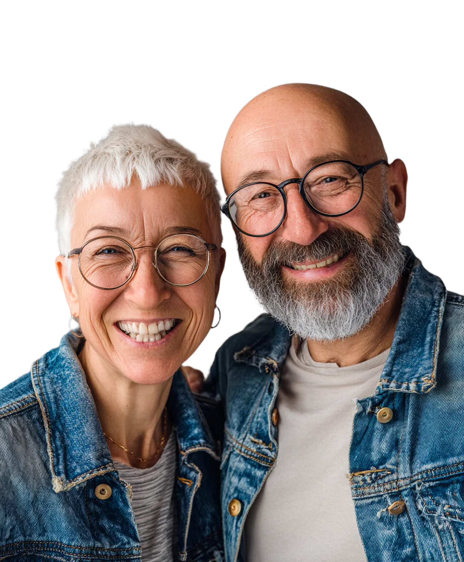 Smiling older couple wearing glasses and denim jackets, posing closely together.