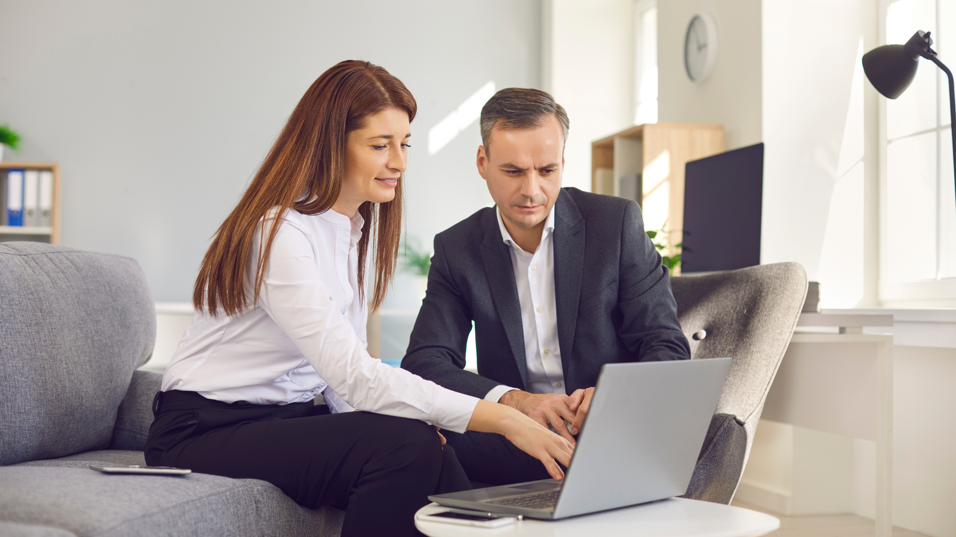 UK business owner conducting business energy comparison using professional platform to compare commercial energy suppliers