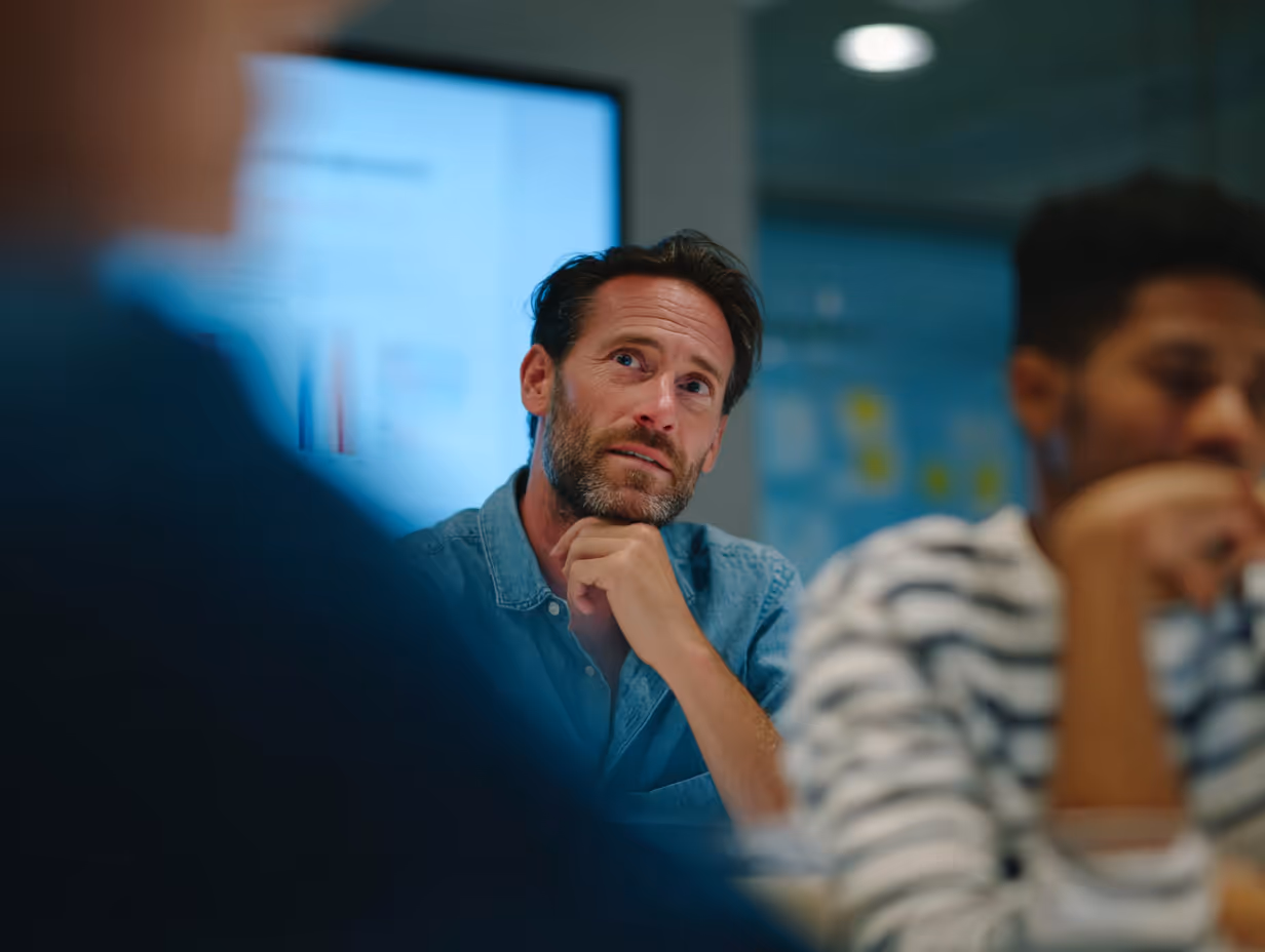 Man thinking in business meeting
