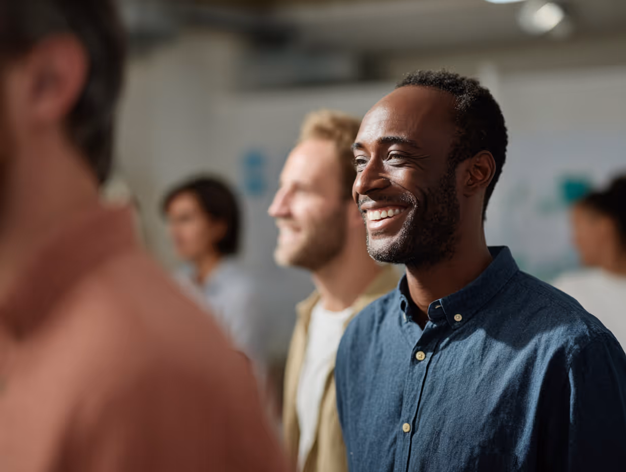 main smiling in group workshop