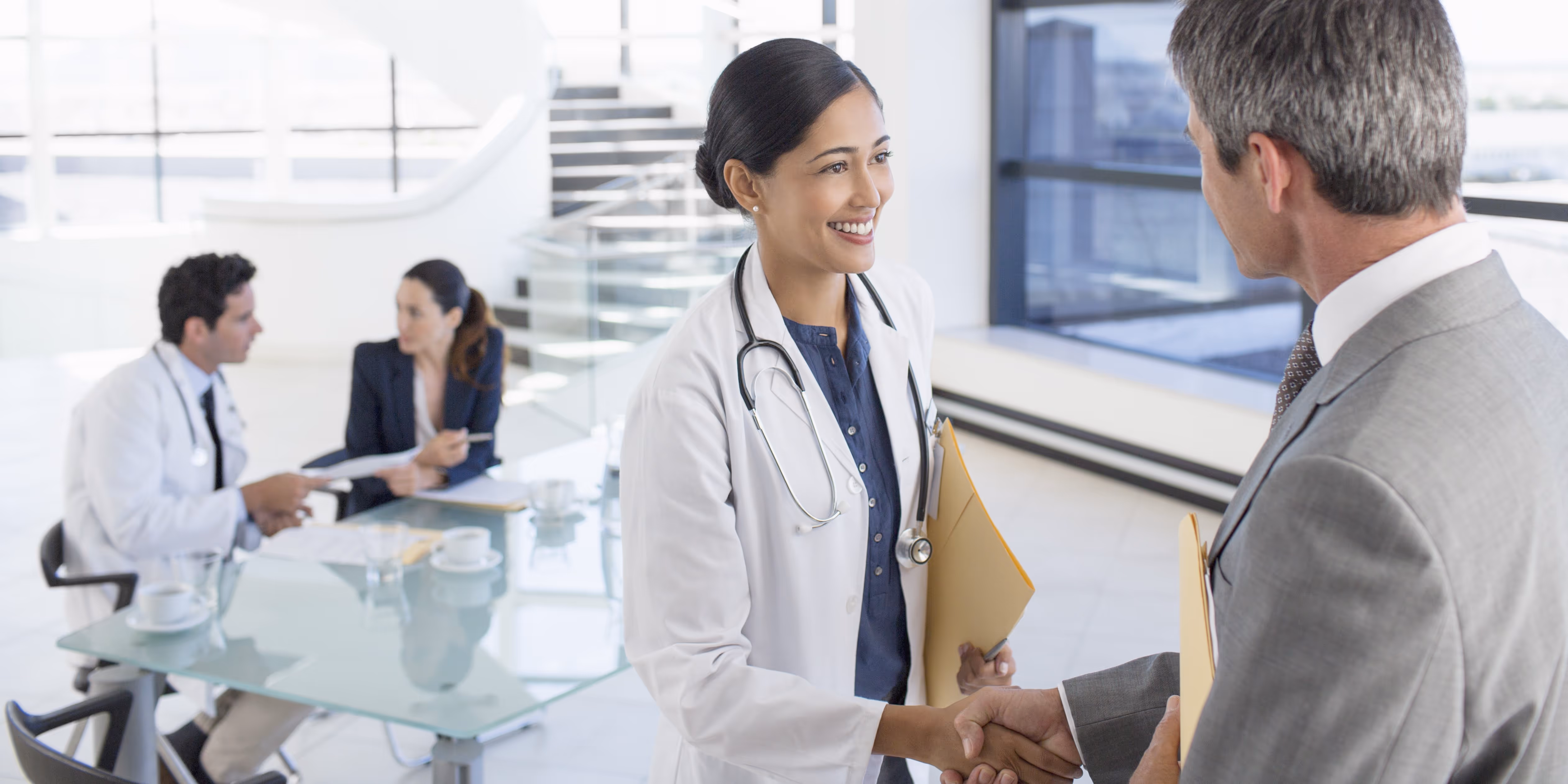 medical professionals shaking hands