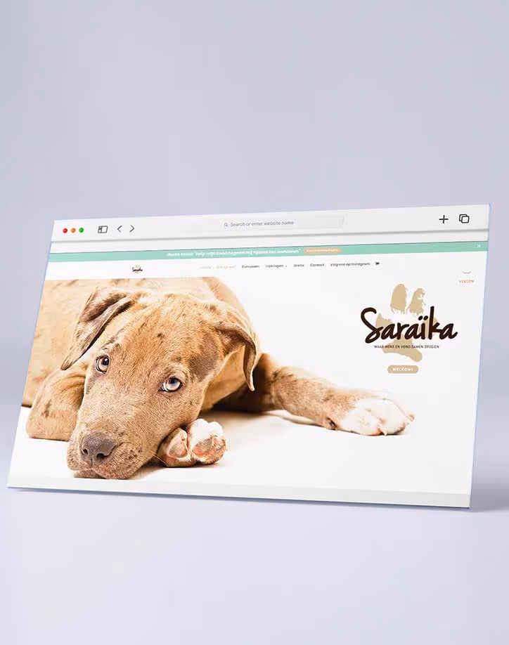 Website homepage featuring a close-up of a lying puppy with light brown fur and blue eyes next to the Saraika logo.