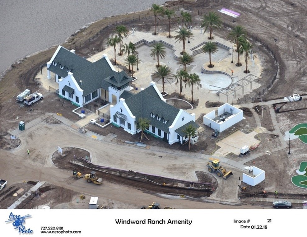 Aerial view of Windward Ranch construction site with white buildings and palm trees