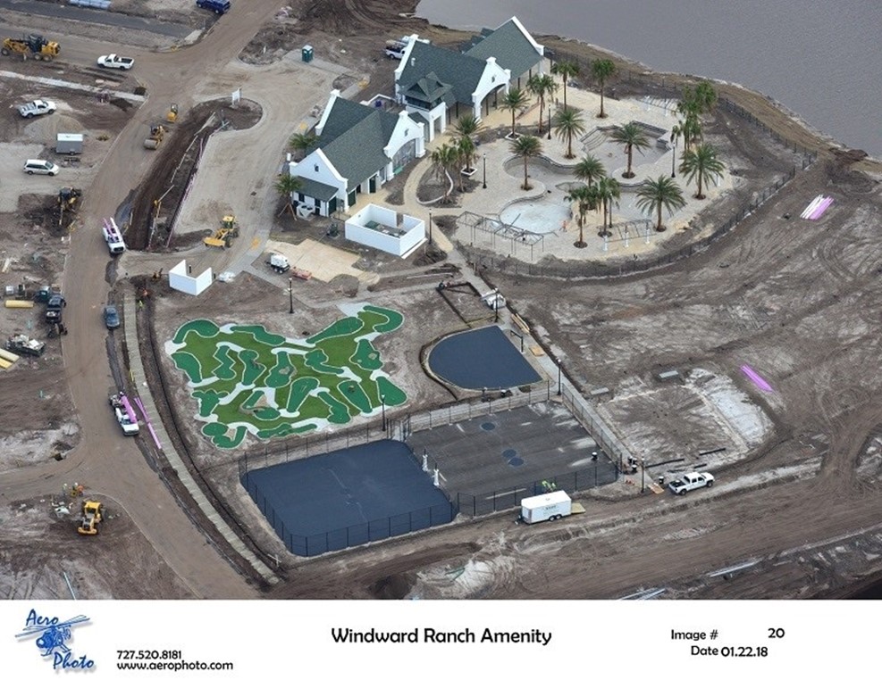 Aerial view of Windward Ranch construction site with mini-golf and palm trees