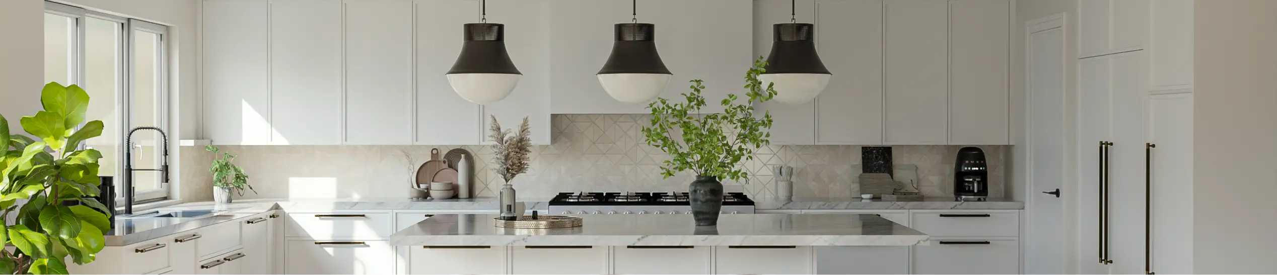 Modern white kitchen with black pendant lights and gold hardware