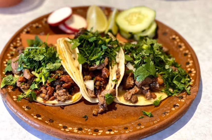 A plate of food with meat and vegetables on it.