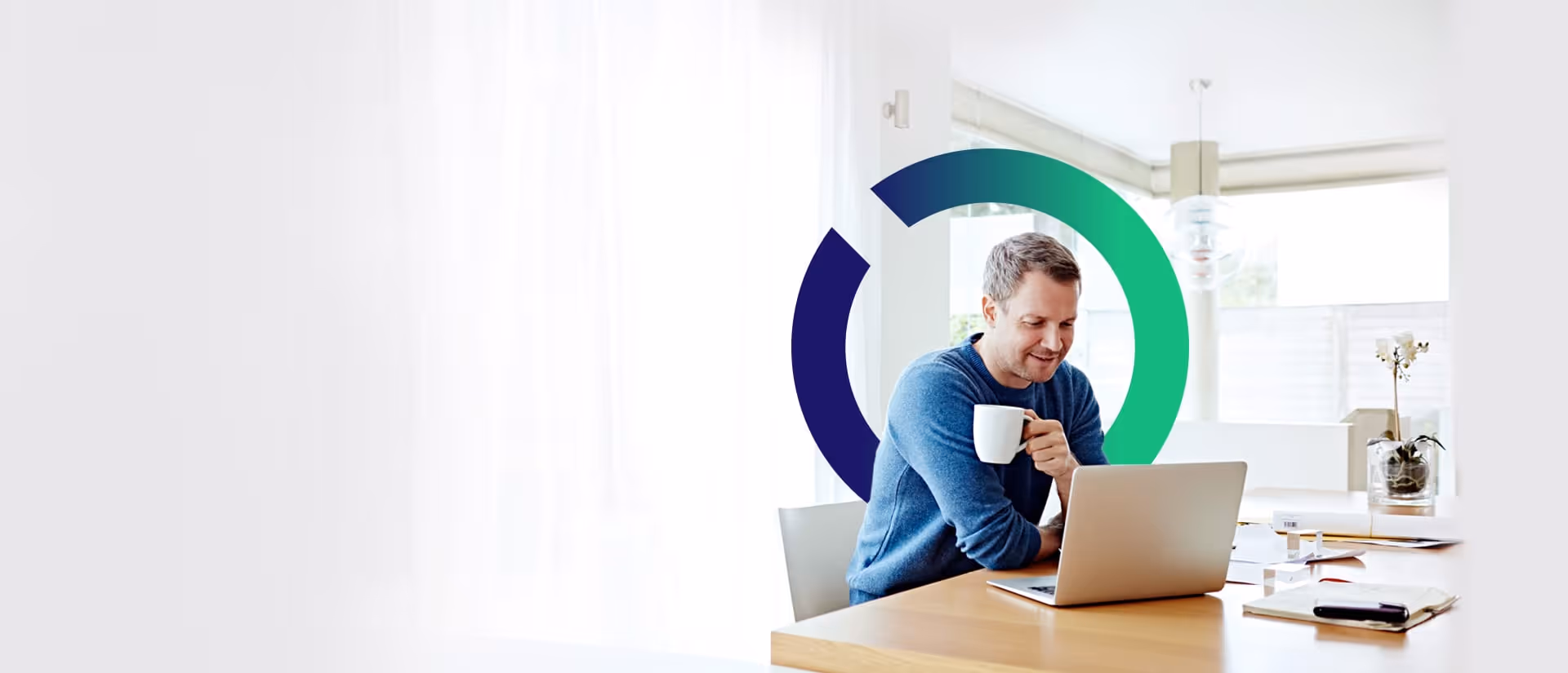 A man uses his laptop, Outseer iris behind him.