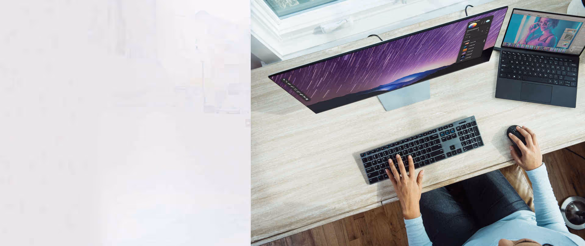 A person uses a computer on a desk. only their hands are visible.