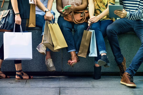 group of friends with shopping bags