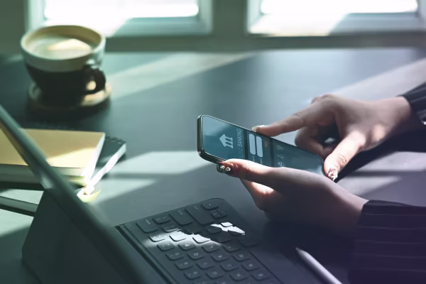 woman logging into her mobile banking app