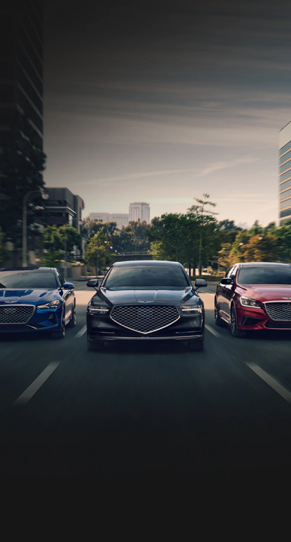 Three Genesis vehicles driving side by side on the road