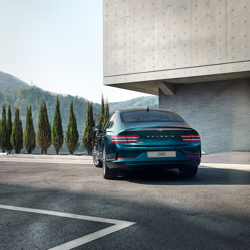 Rear view of blue Electrified G80