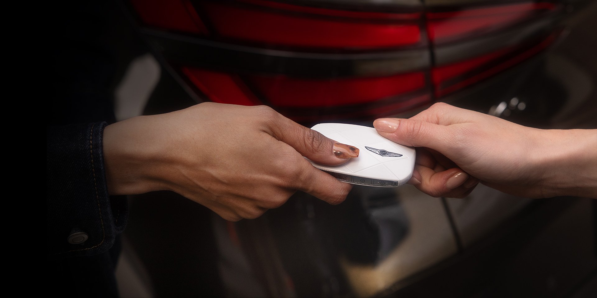 Customer being handed Genesis key fob