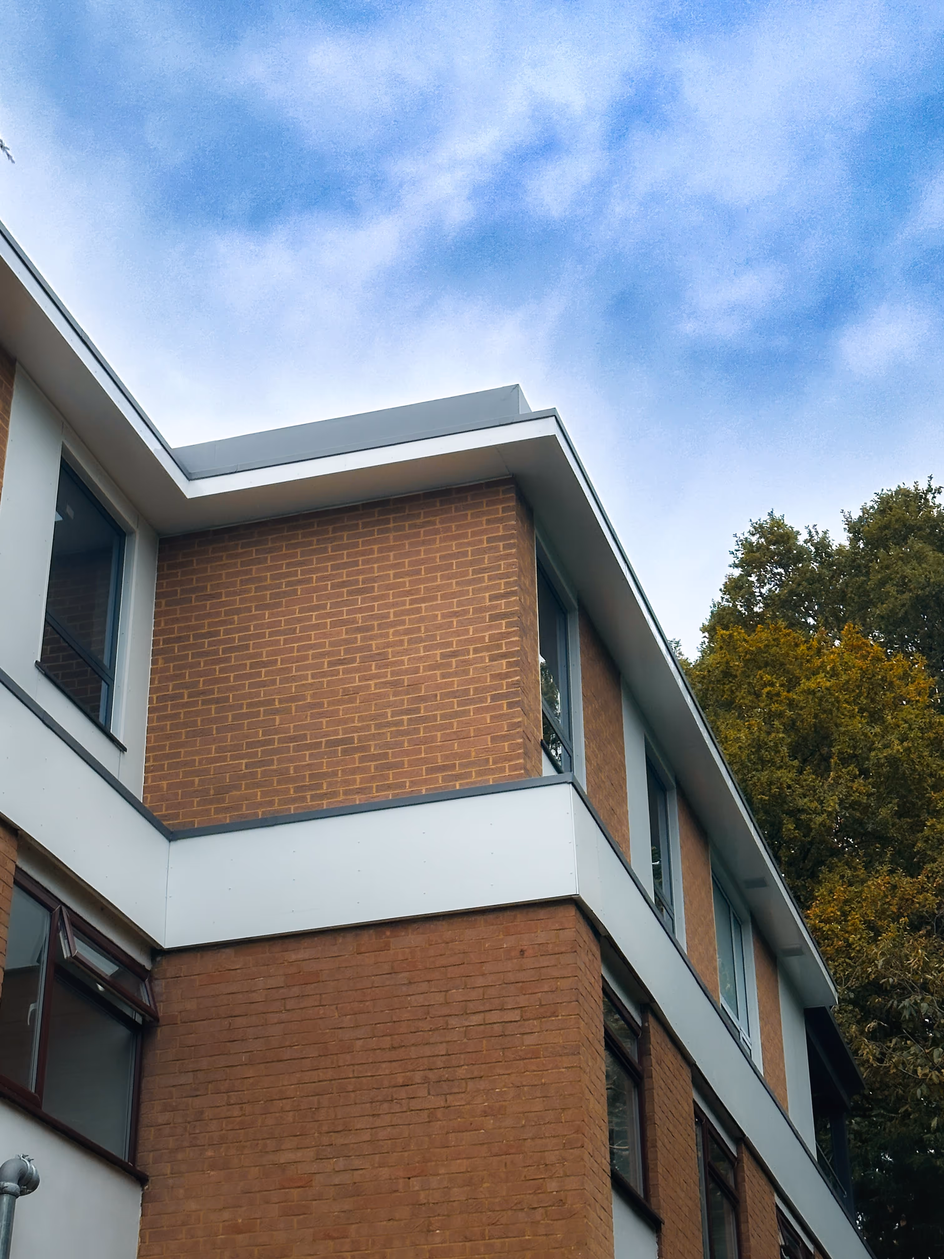 Photo looking up at a corner of a new floor built by Khandys