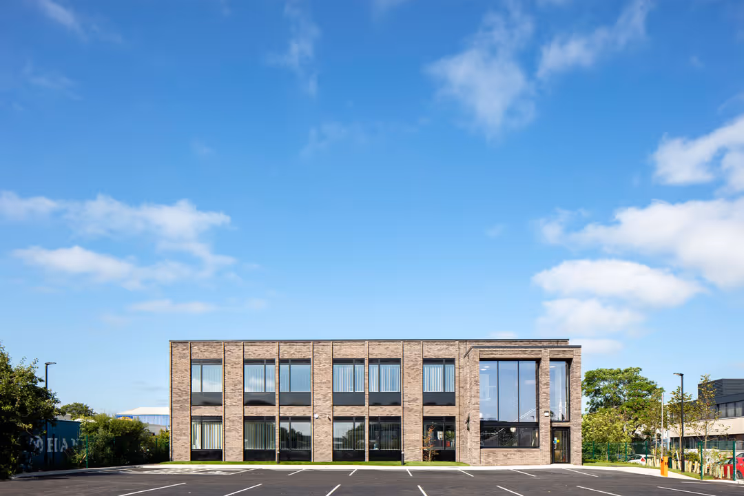 A wide shot of a large building with brick textures. Taken for an architectural project at Howard Chase
