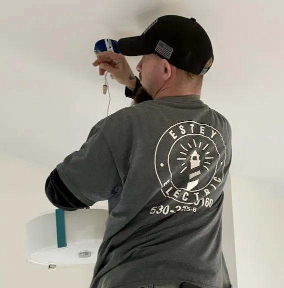 Electrical repairs in a home showing ceiling light fixtures being replaced.