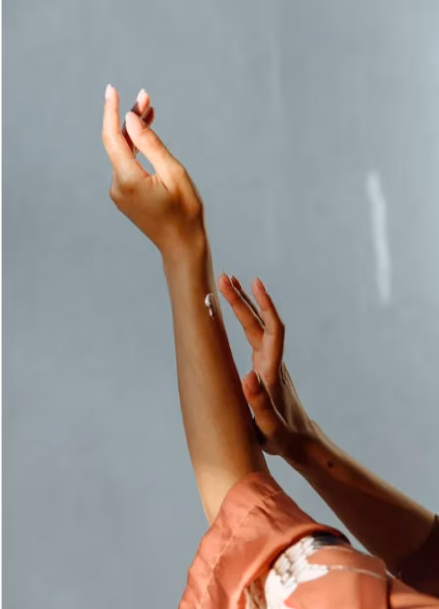woman putting on sunscreen 
