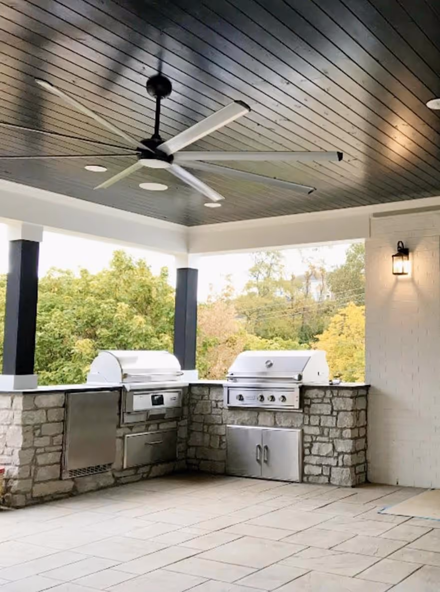 Outside grills and ceiling fan on back porch