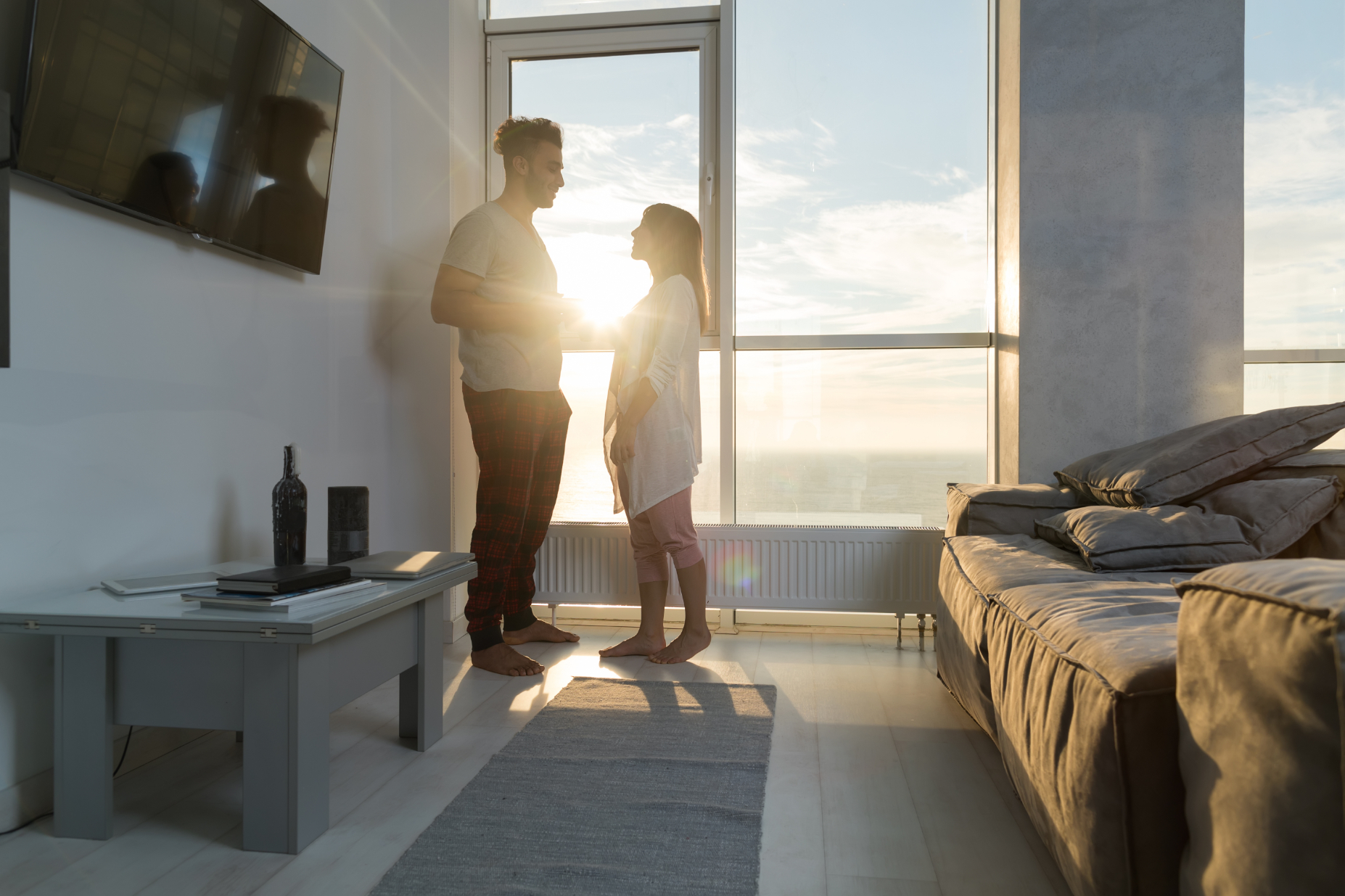 couple in front of window stock image
