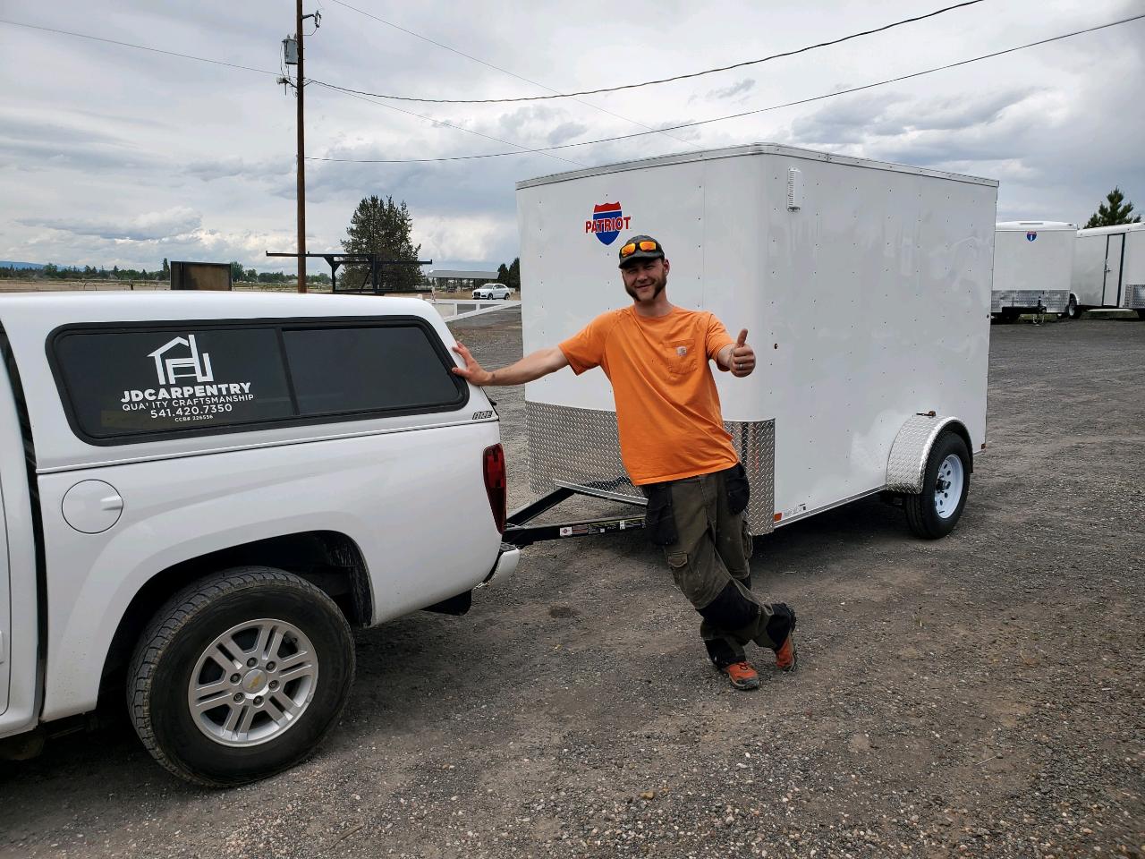 Jesse in front of work vehicle