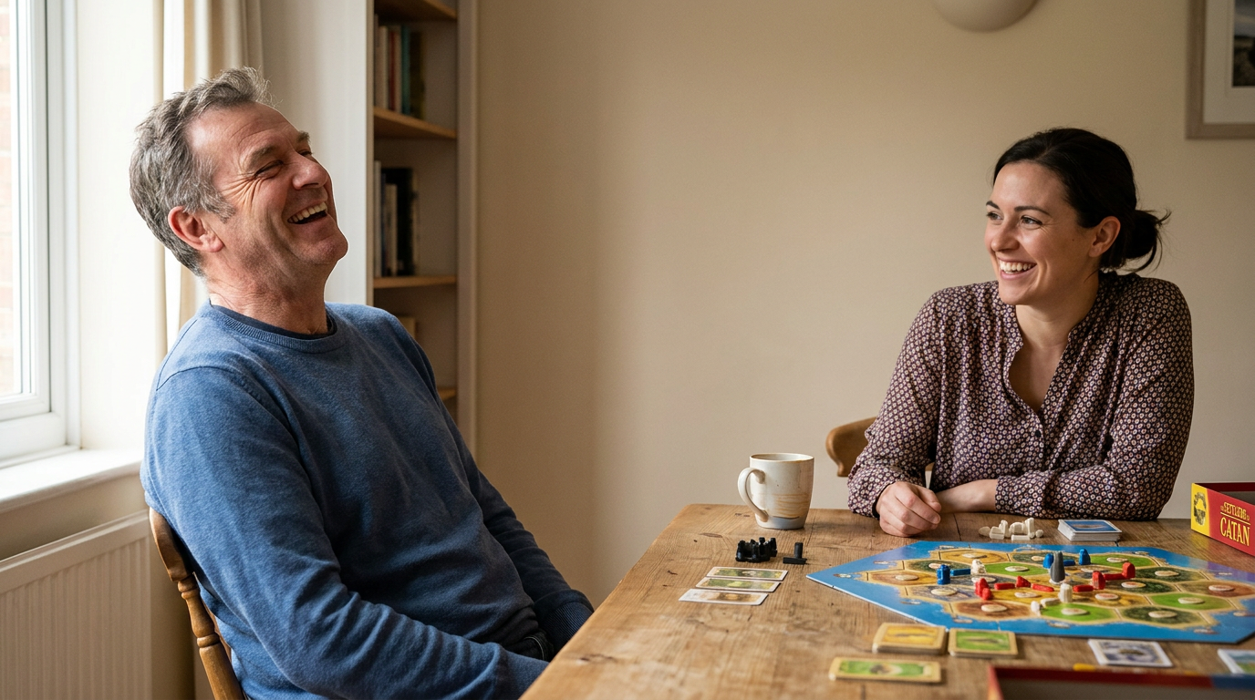 Jack, is laughing heartily while playing a board game with his adult daughter, Rebecca.