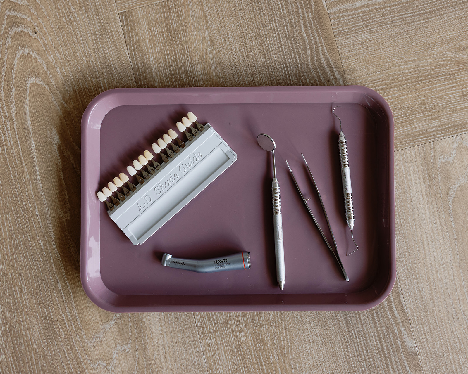Dental shade guide and instruments used to match natural-looking tooth-colored fillings.