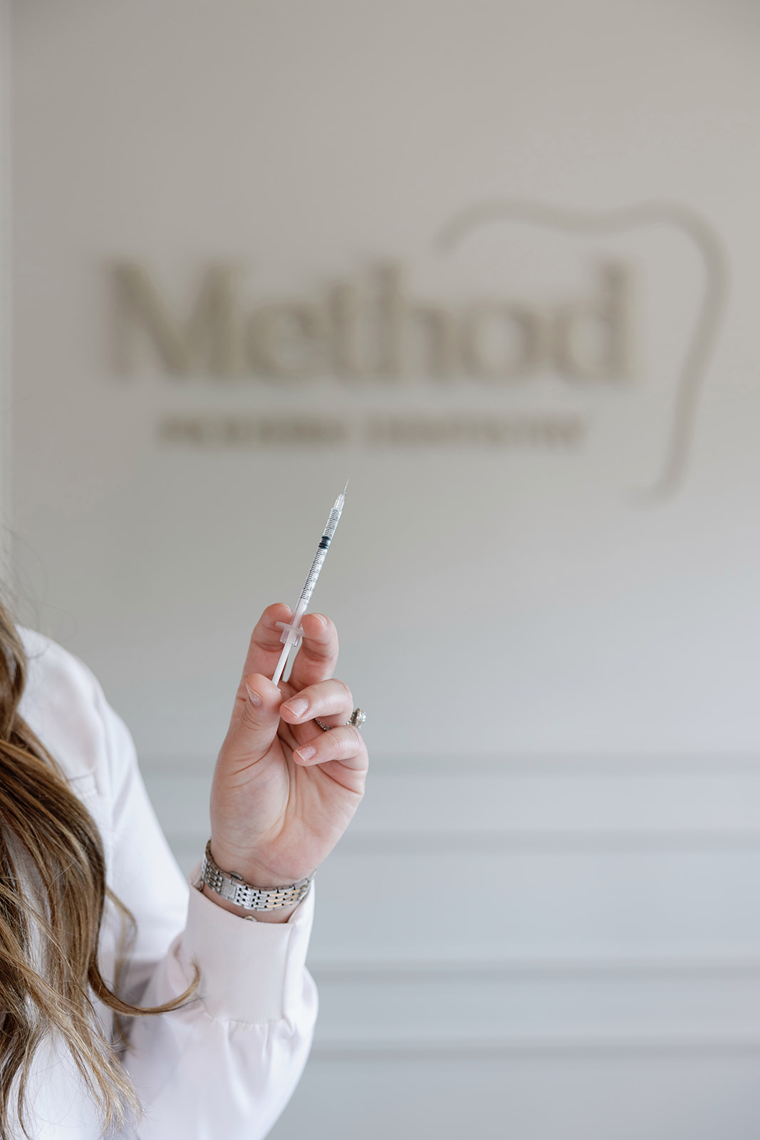 Close-up of a cosmetic injectable syringe at Method Modern Dentistry.