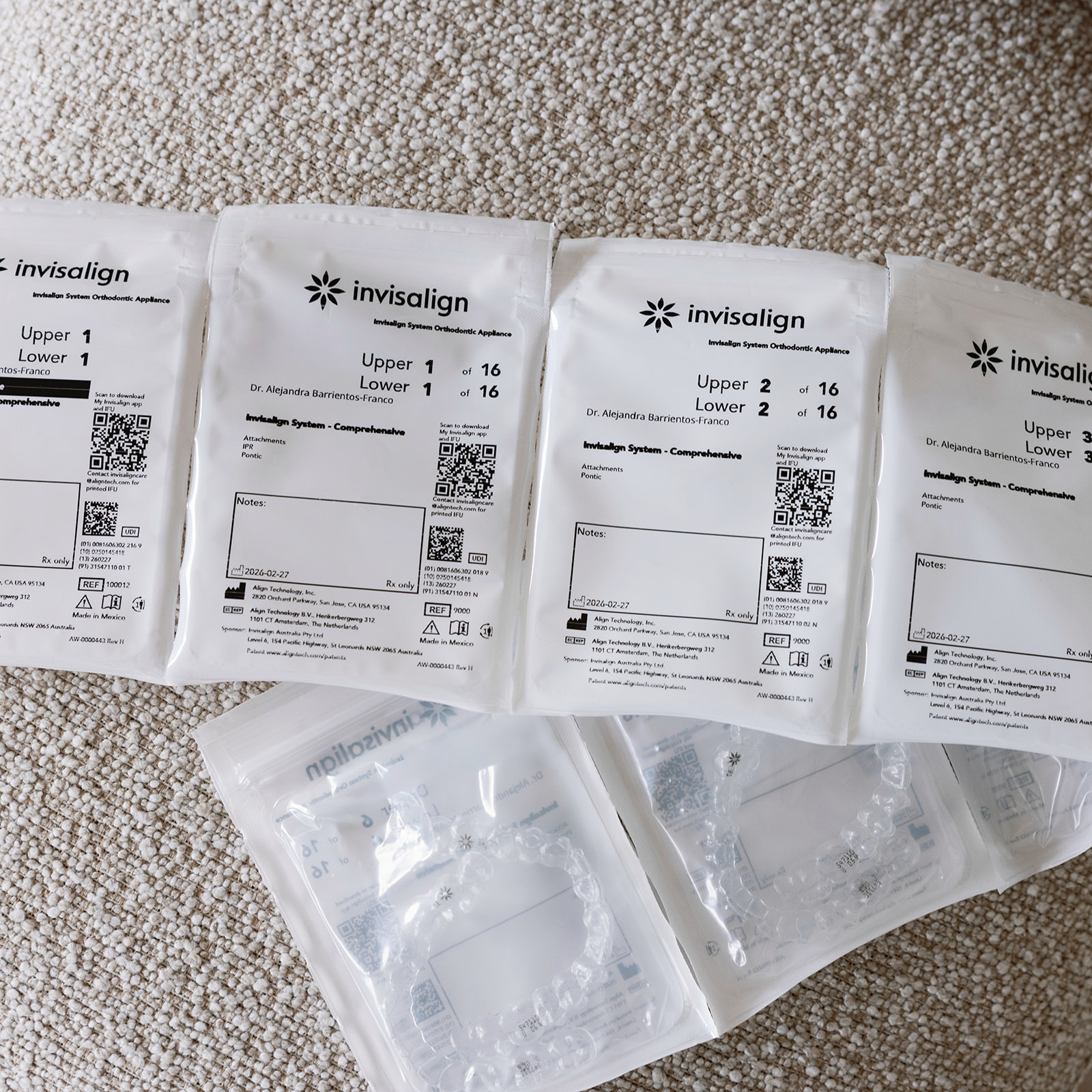 Invisalign clear aligner packages arranged for orthodontic treatment.