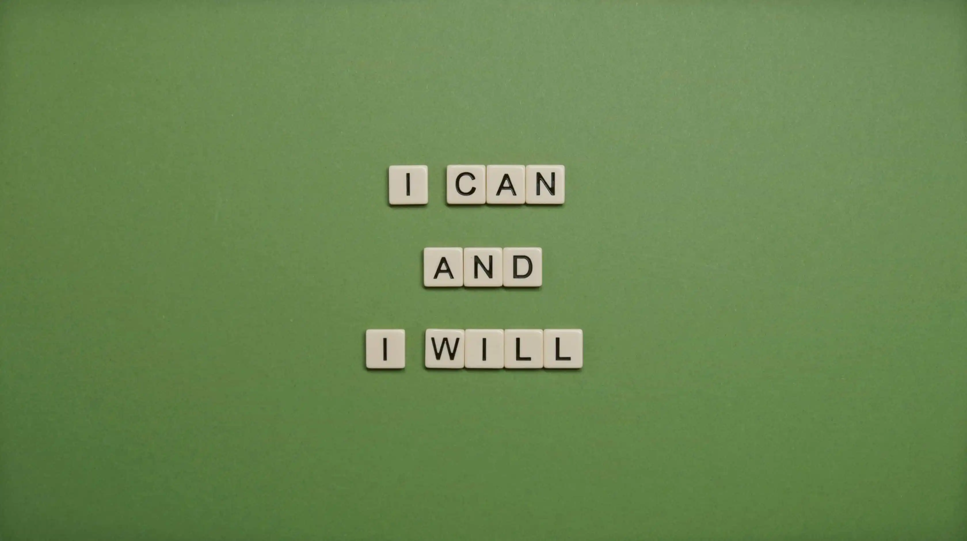 Scrabble-like pieces spelling out "I can and I will".
