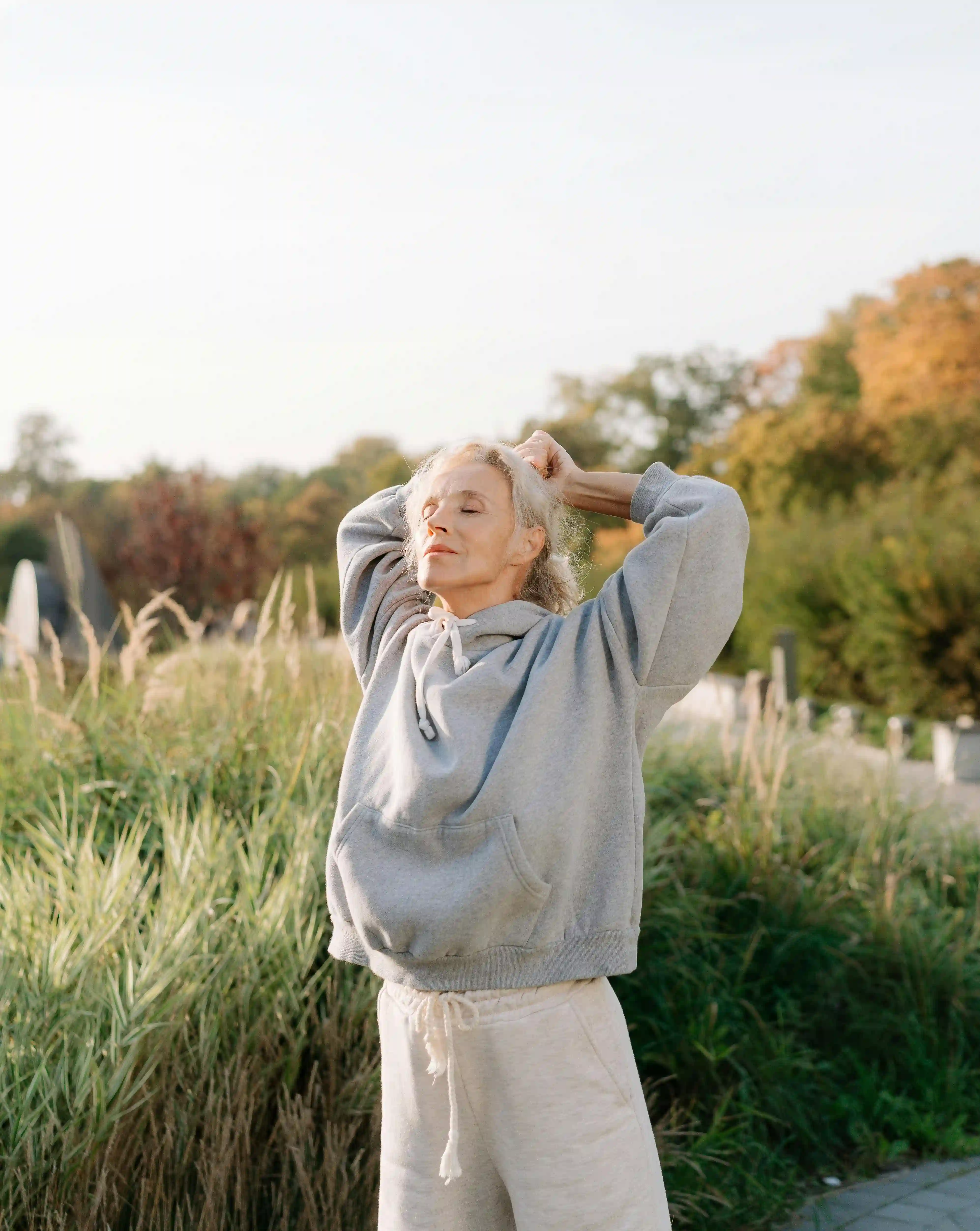 Woman stretching with eyes closed.