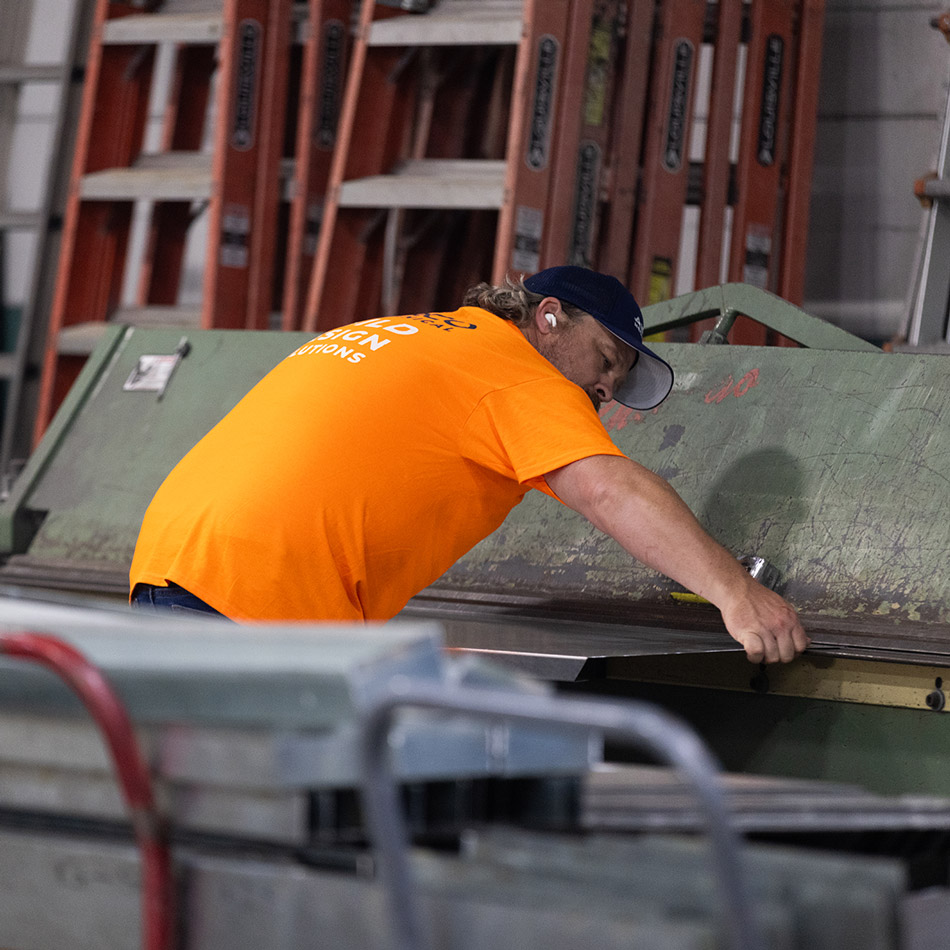 Fabricator working with sheet metal at Airco Mechanical Services