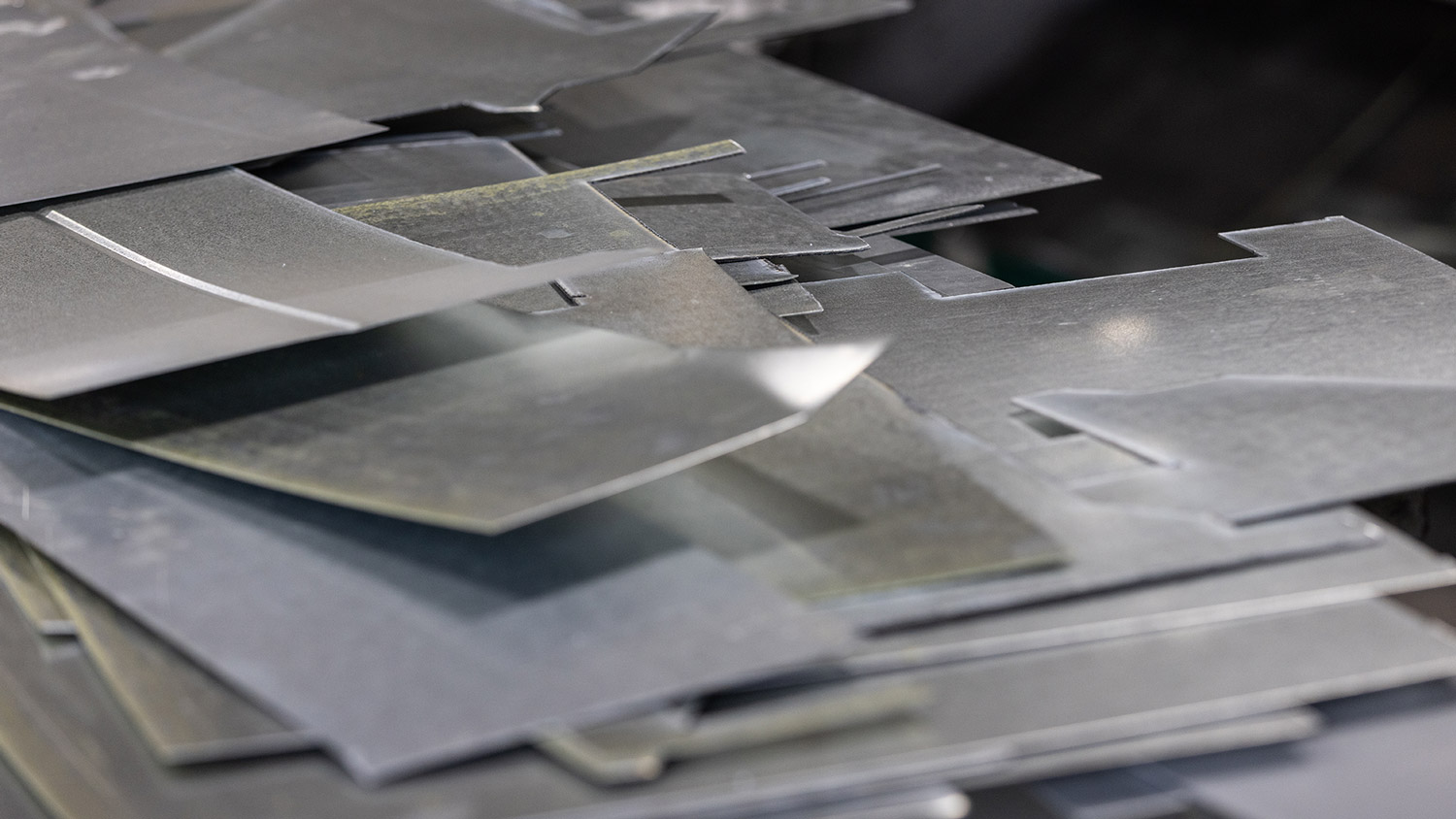 Stack of precision-cut metal sheets for industrial manufacturing