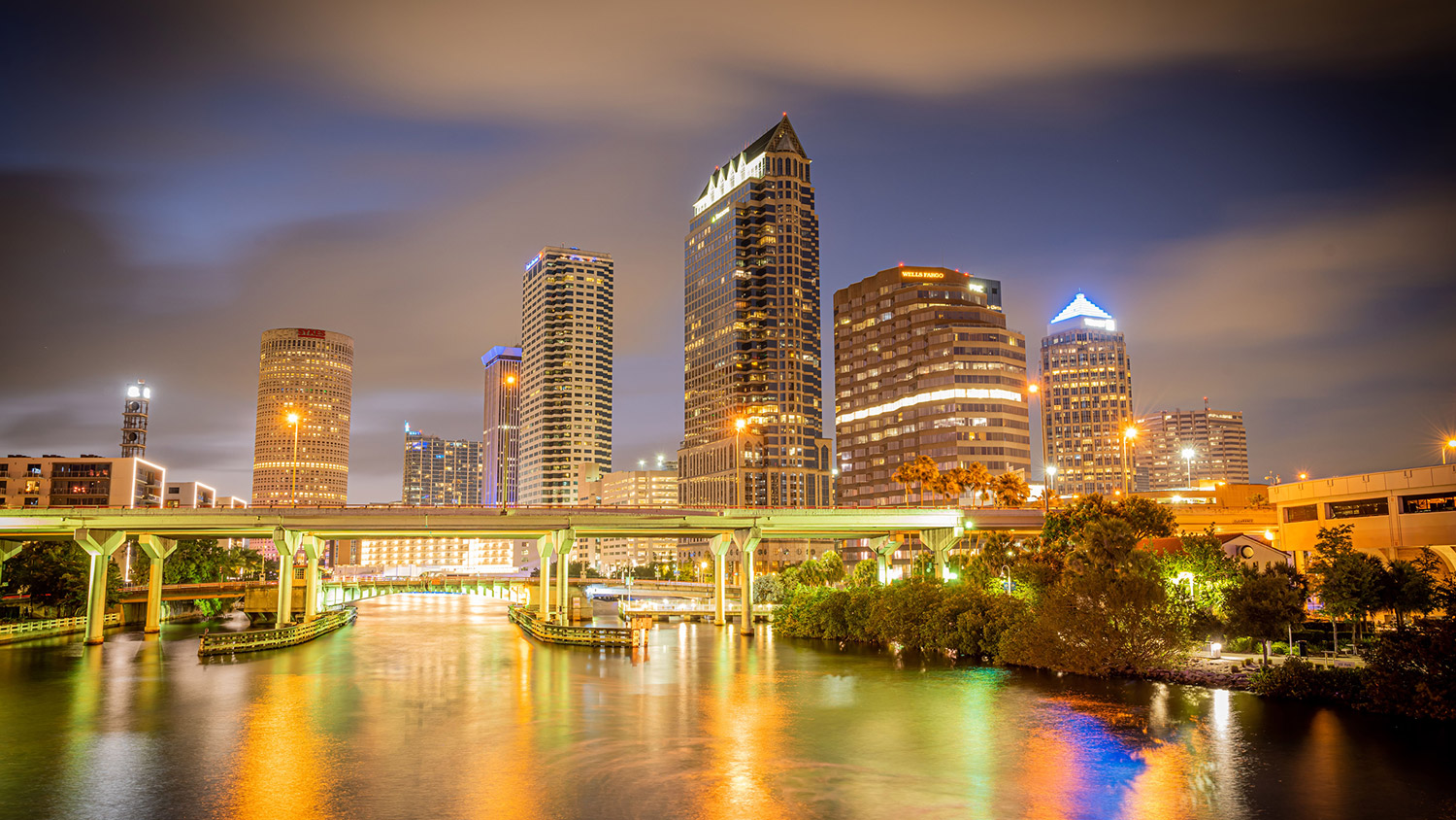 Nighttime view of downtown Tampa skyline reflecting on the water