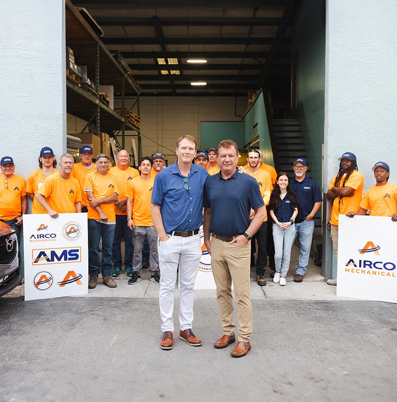 Airco Mechanical Services leadership team with staff outside company headquarters in Largo, Florida