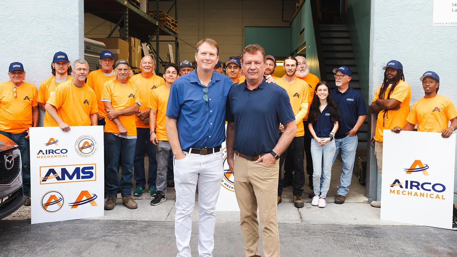 Airco Mechanical Services leadership team with staff outside company headquarters in Largo, Florida