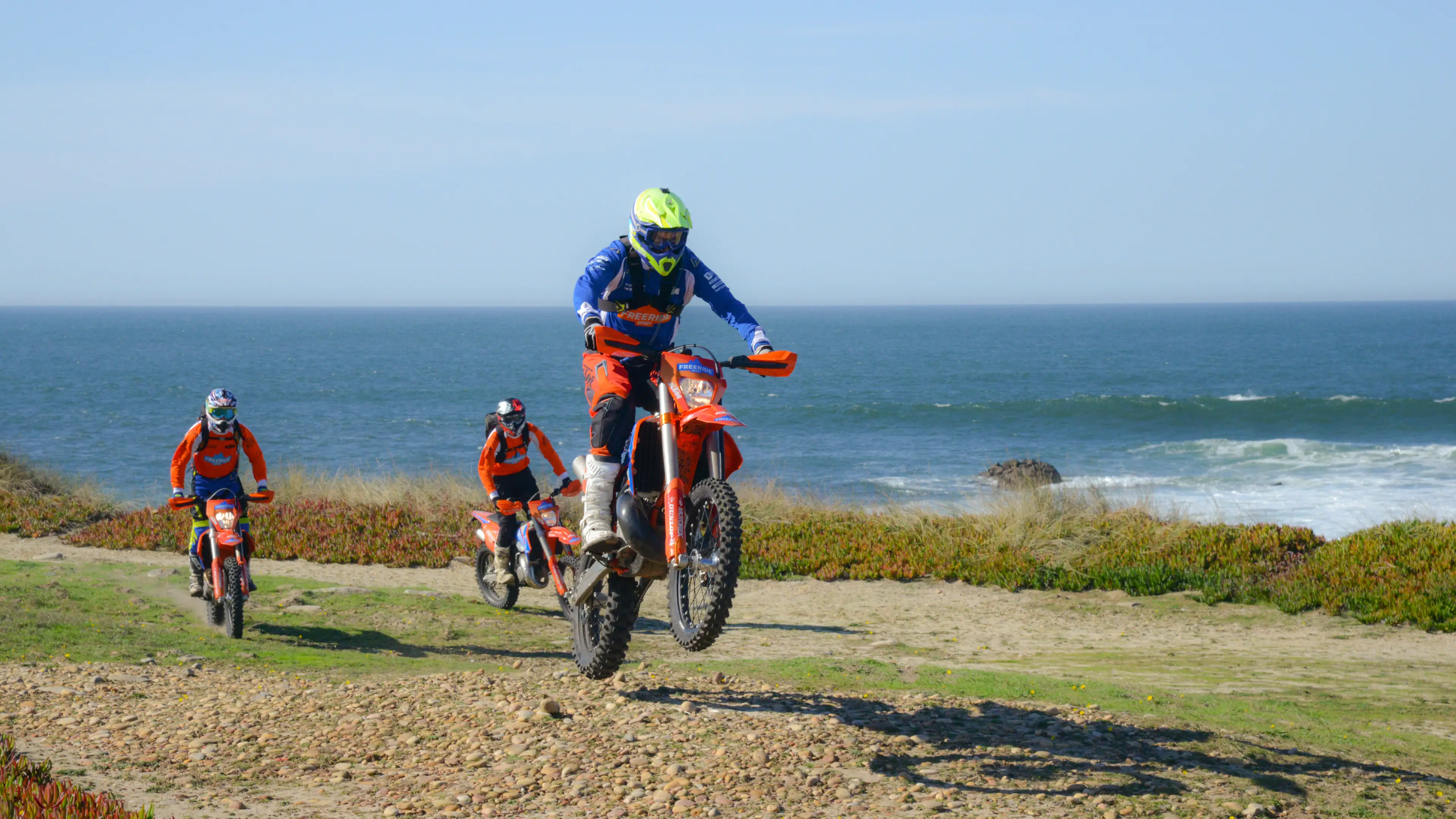 Riders with the ocean on the background