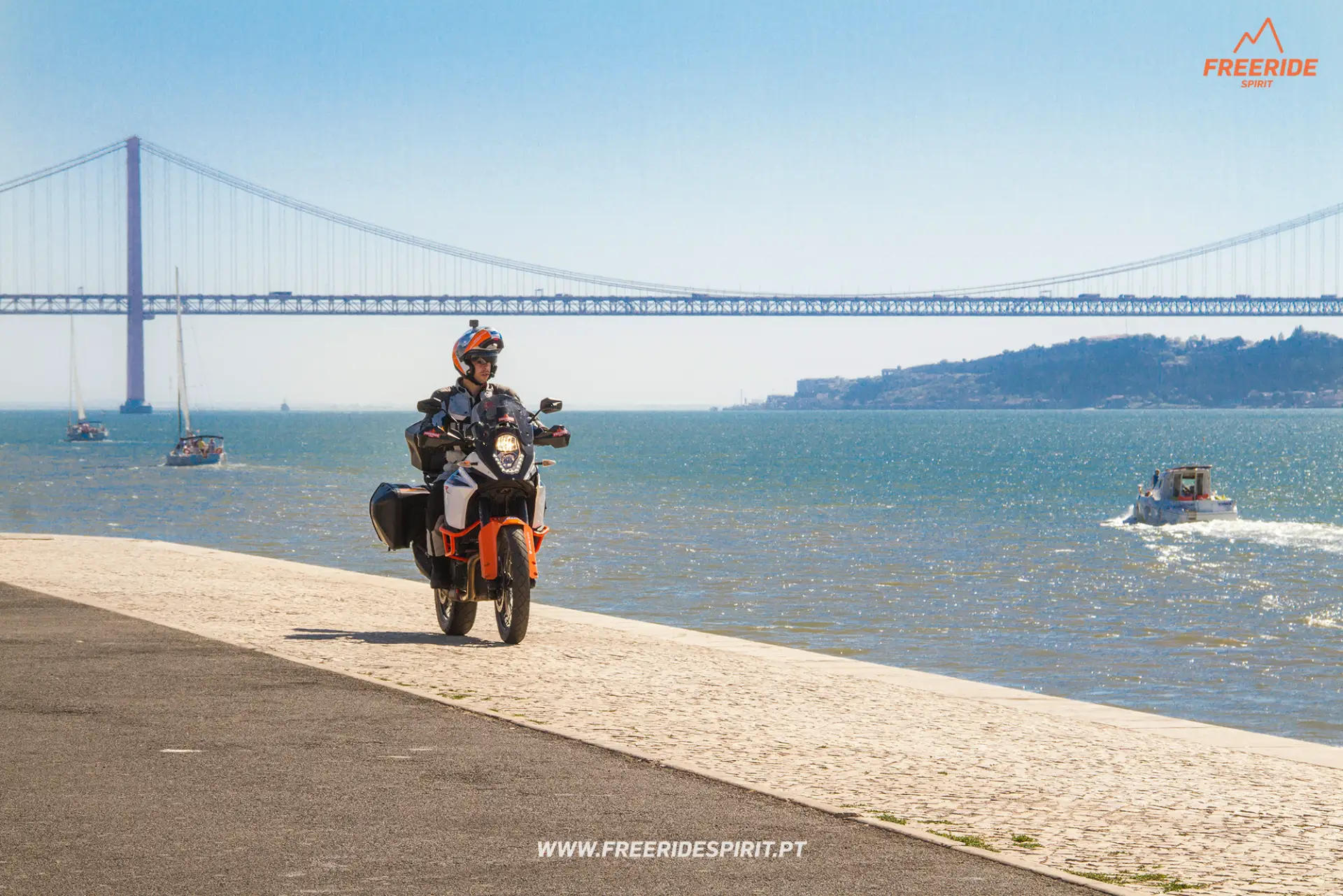 Freeride Spirit rider and 25 de Abril Bridge