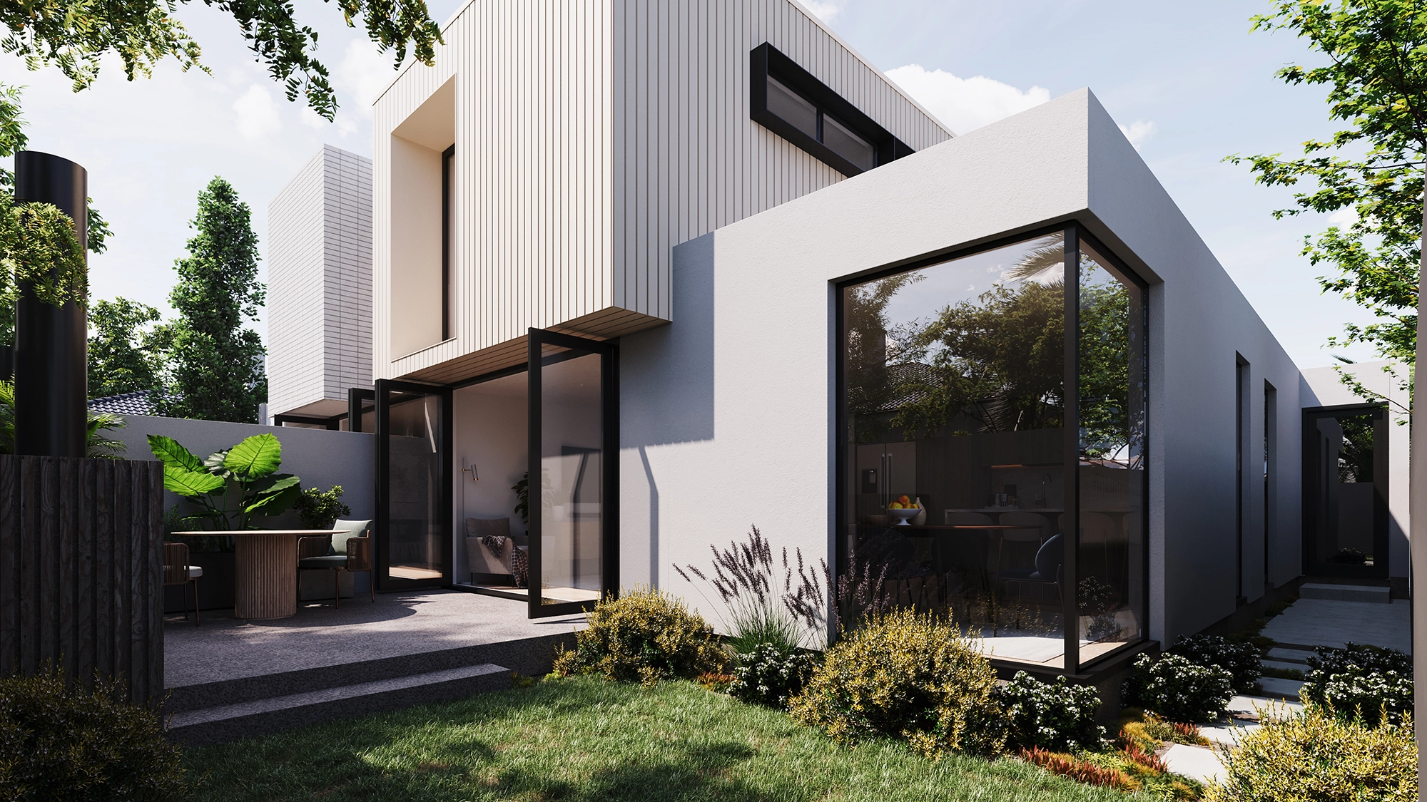 Courtyard at Hills Road showing concrete and timber cladding, exposed aggregate patio, alfresco dining area, and sliding doors opening onto the lawn.