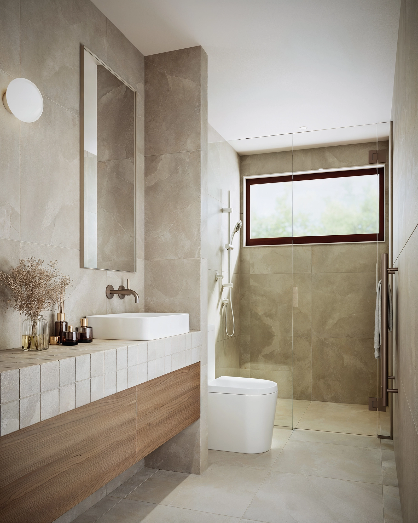 Modern bathroom with beige tiles, wooden vanity, white sink, toilet, glass shower, and a window.