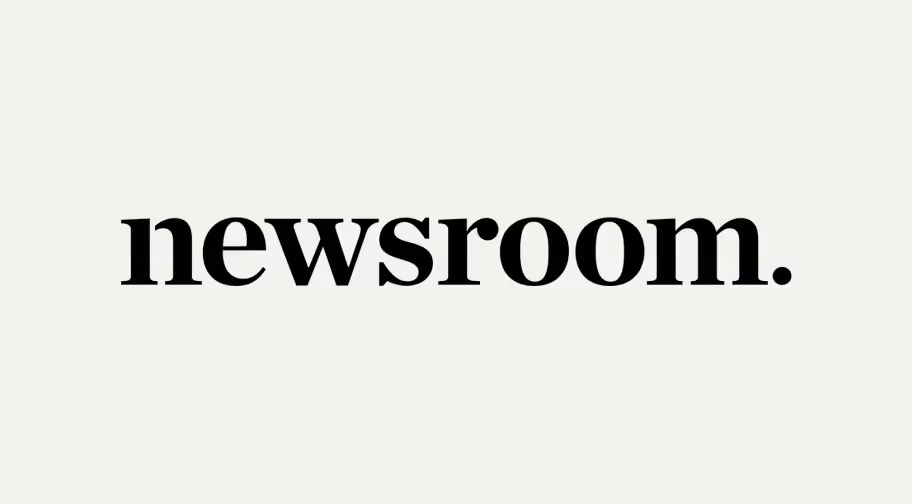 Text reading 'newsroom.' in bold black font on a light background.