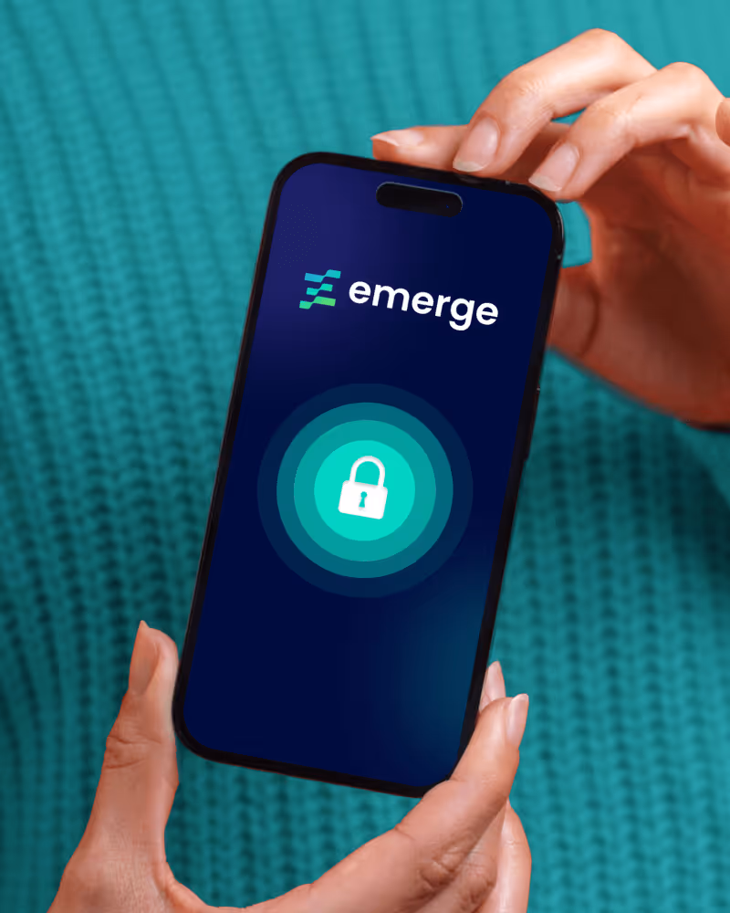 Hands holding a smartphone showing a locked padlock icon and the text 'emerge' on the screen.