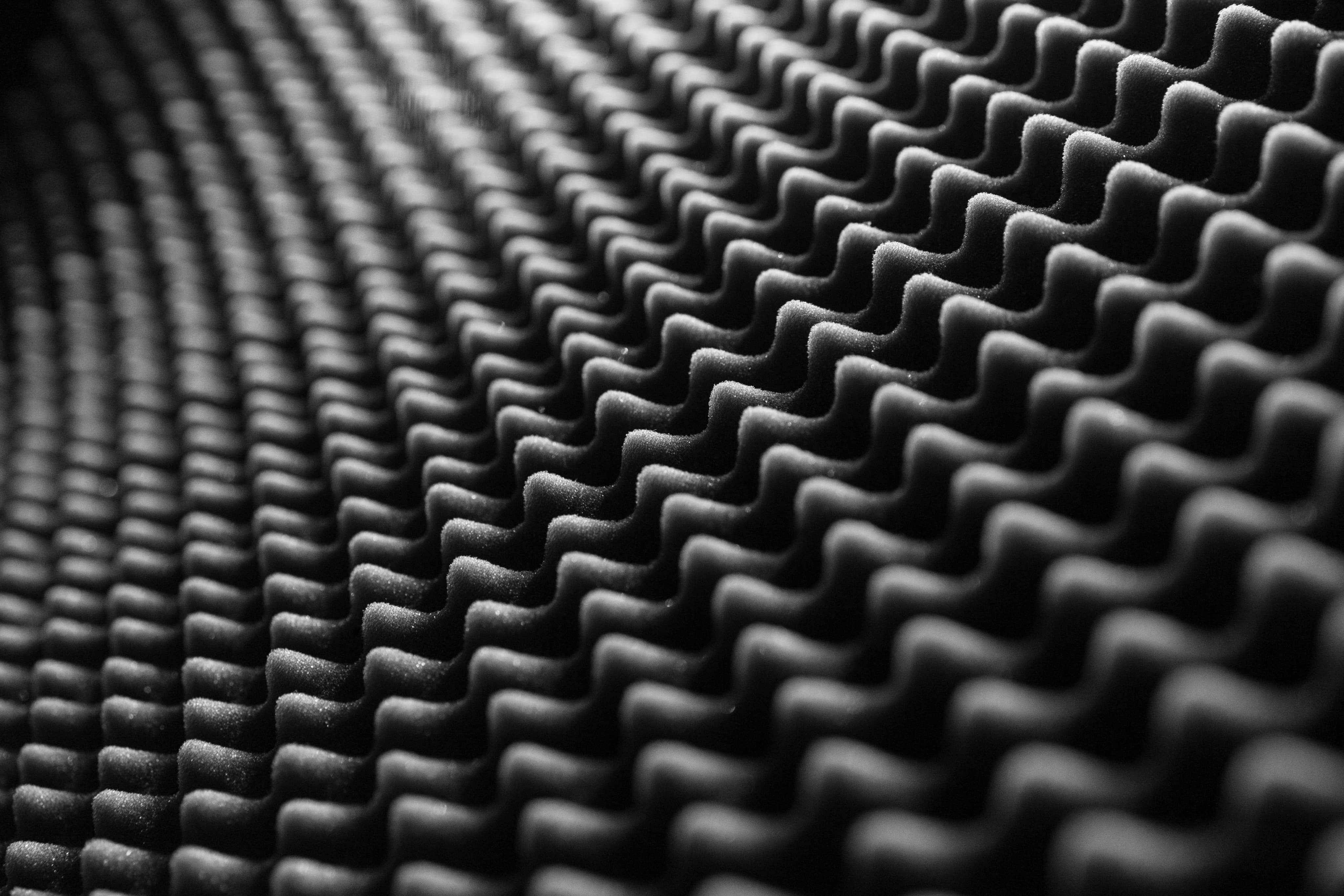 Acoustic pad in color black.