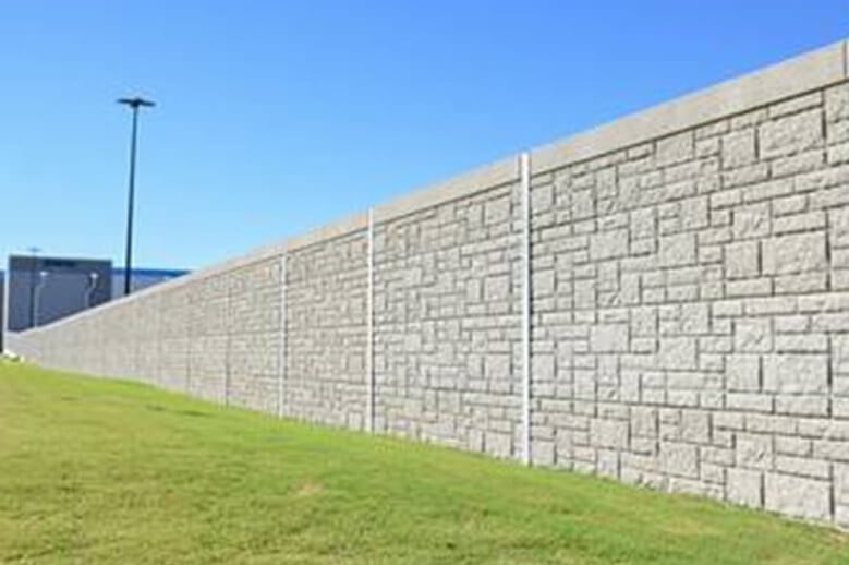 A long wall in a meadow.