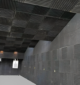 A room with acoustic pads both in the walls and ceilings.