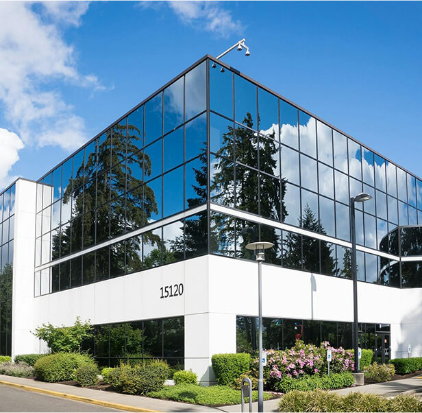 A building with glass reflective walls.